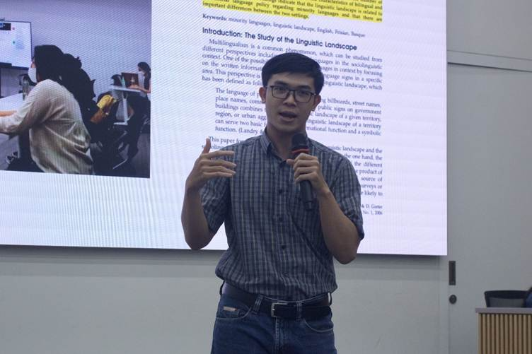 A person standing in front of a projector screen
AI-generated content may be incorrect.