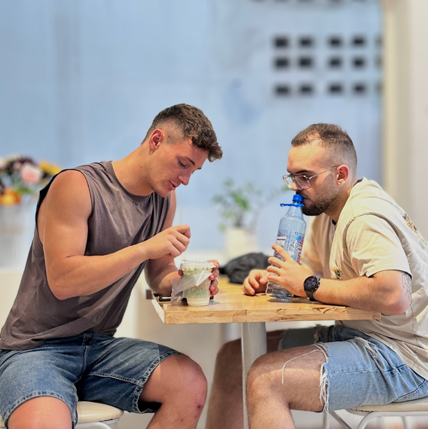 Two men sitting at a table

AI-generated content may be incorrect.