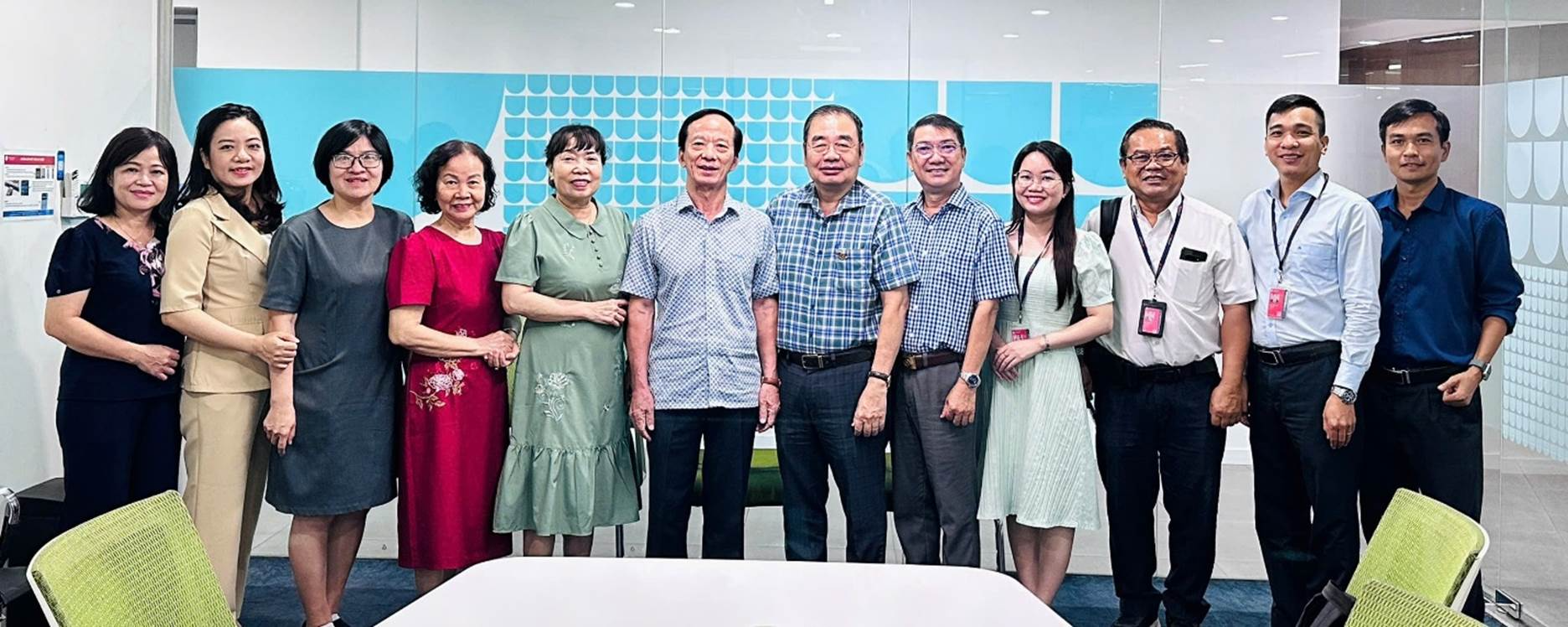 A group of people posing for a photo

Description automatically generated