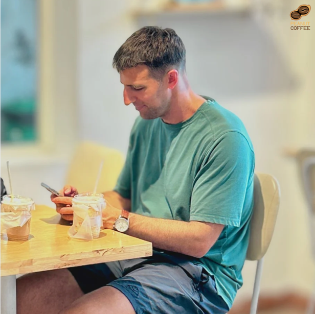 A person sitting at a table looking at his phone

AI-generated content may be incorrect.