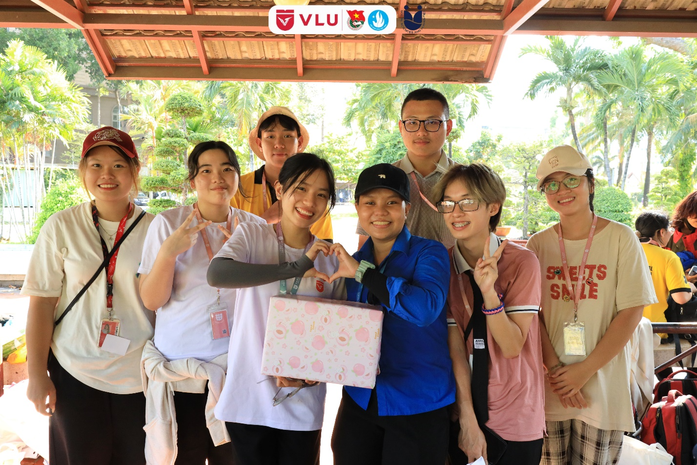 A group of people posing for a photo

Description automatically generated